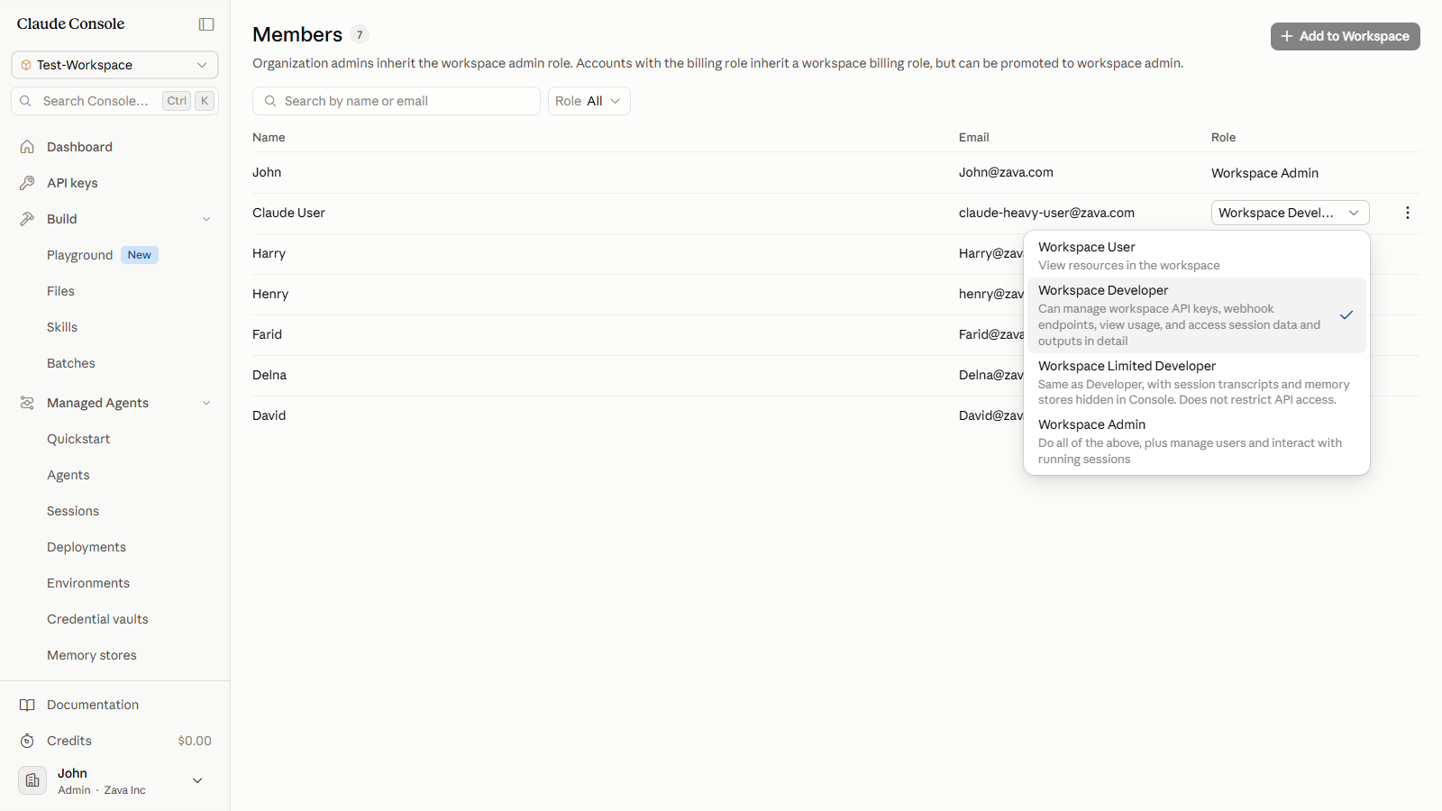 Role dropdown open on the member's row, showing the four workspace roles with the current role check-marked